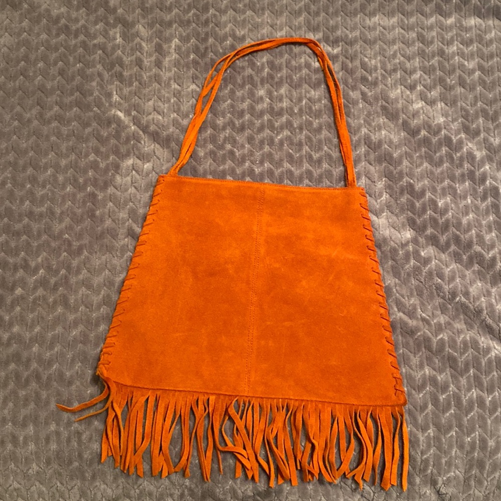 Orange suede fringe purse.